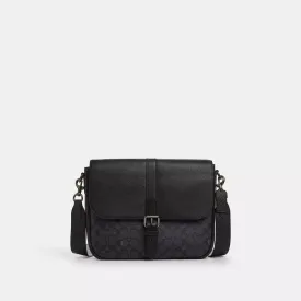 Coach Outlet Warner Messenger Bag In Signature Canvas